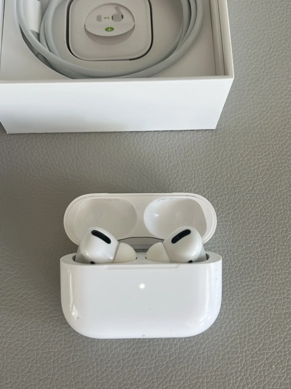 Apple AirPods Pro with charging cord